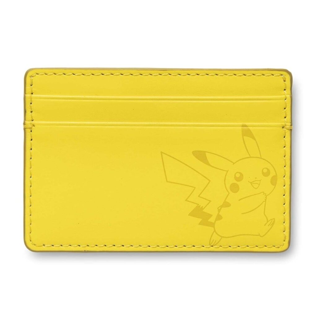 e2aa0ac5-f06d-5043-ae7c-ca9e1f00017f-1024x1024-1.jpg Pokémon Center × Fossil: Pikachu Yellow Leather Steven Card Case - Image 1